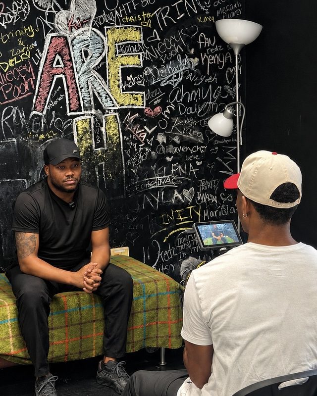 Larnelle Hardy being interviewed on camera
