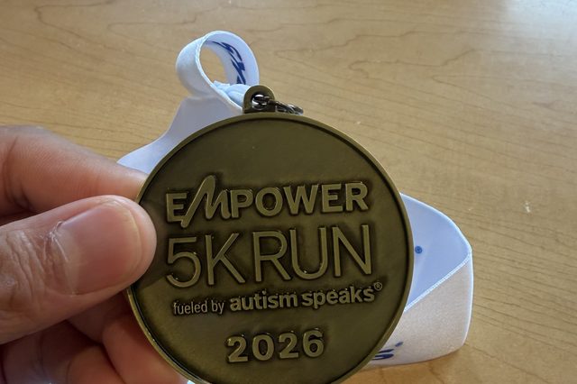 Larnelle Hardy's 2026 Empower 5K Run medal, benefiting Autism Speaks