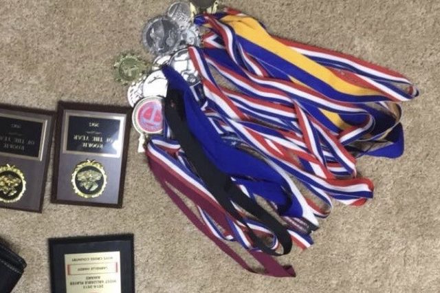 Larnelle Hardy's cross country and MVP medals and plaques